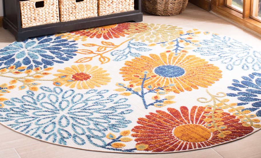 round floral print rug in entryway