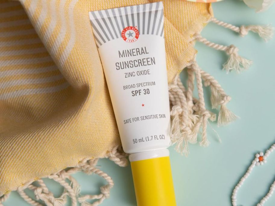 A tube of First Aid Beauty Mineral Sunscreen