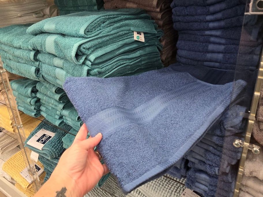 Hand touching a Kohl's The Big One Bath Towel