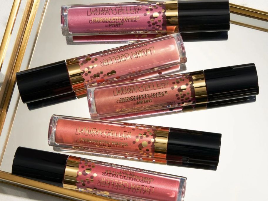 Several lip tint tubes on a mirror