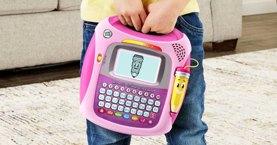 boy holding pink LeapFrog Mr Pencil's Scribble Write and Read