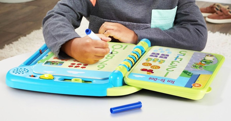 boy writing in LeapFrog Prep for Preschool Math Book