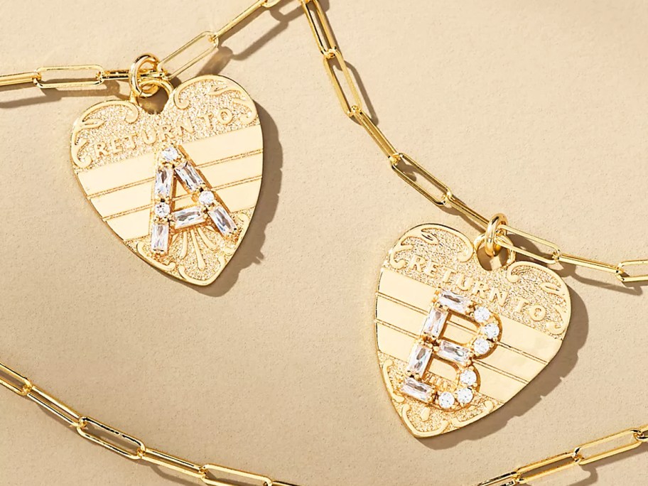 two gold heart monogram necklaces