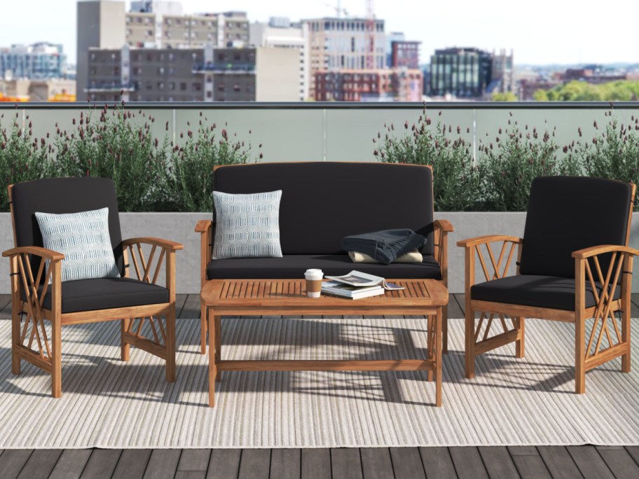 display of 4 piece sofa couch with black cushions 