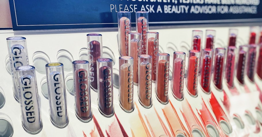 store display of different shades of lip glosses