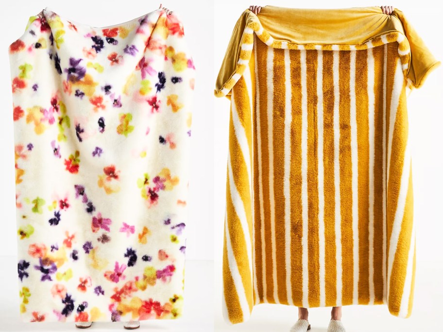 two women holding up floral print and yellow striped fur throw blankets