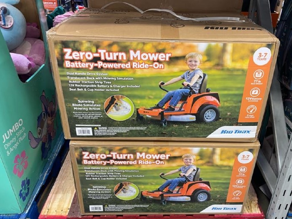 Kids riding lawnmower in box at Sam's Club