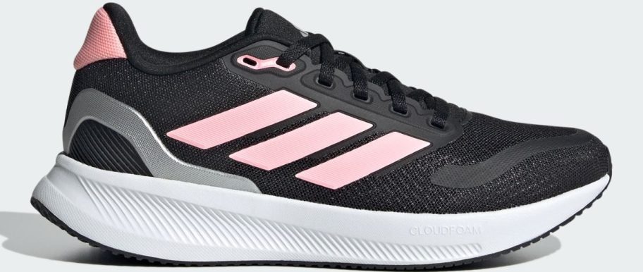 a kids black and pink running shoe
