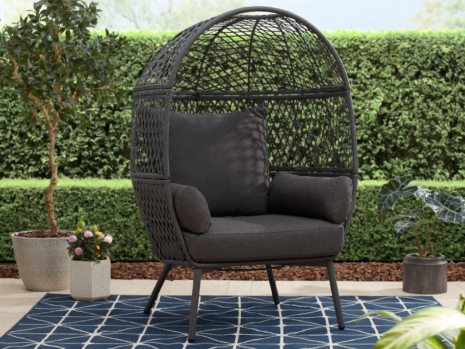 black egg chair on patio 