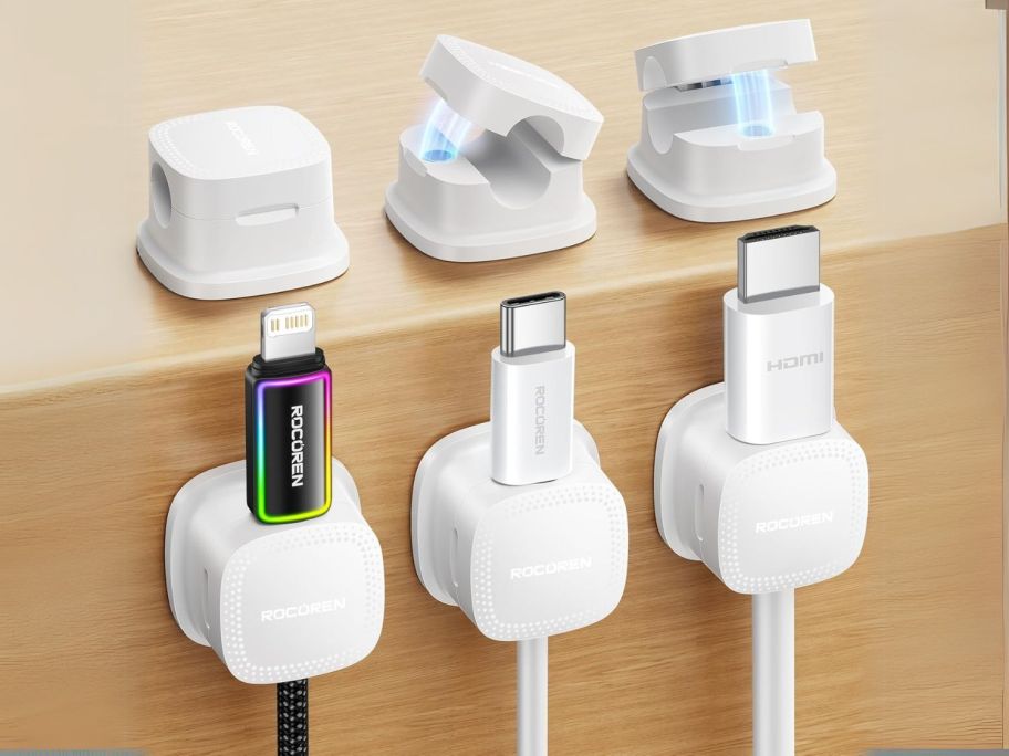 three Magnetic Cable Clips sitting on desk and three others on back of desk holding cords