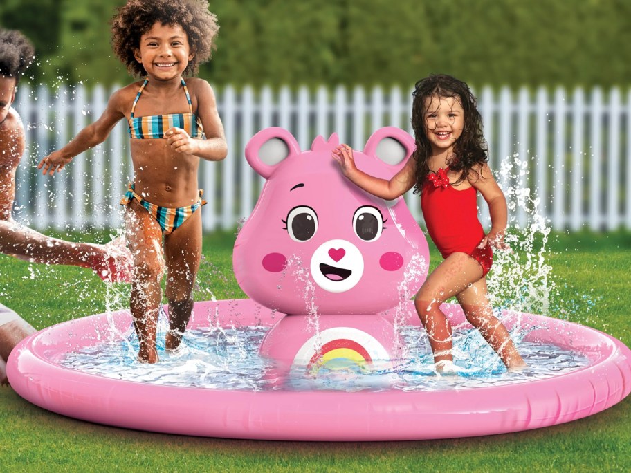 kids playing in care bear splash pad 