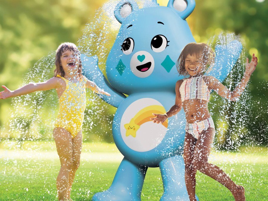 kids playing with care bear sprinkler 