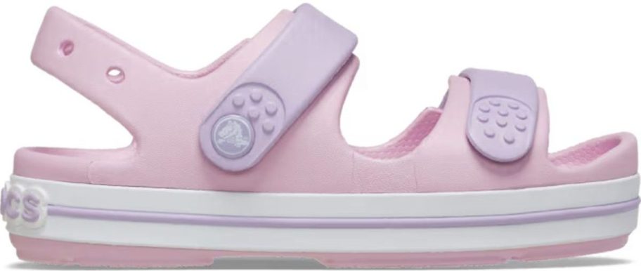 pink and purple Crocs Kids' Crocband Cruiser Sandal stock image