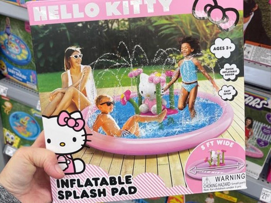 hand holding hello kitty splash pad 