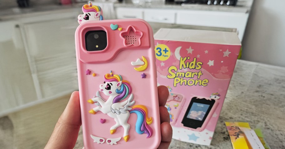 hand holding a pink kids smart phone