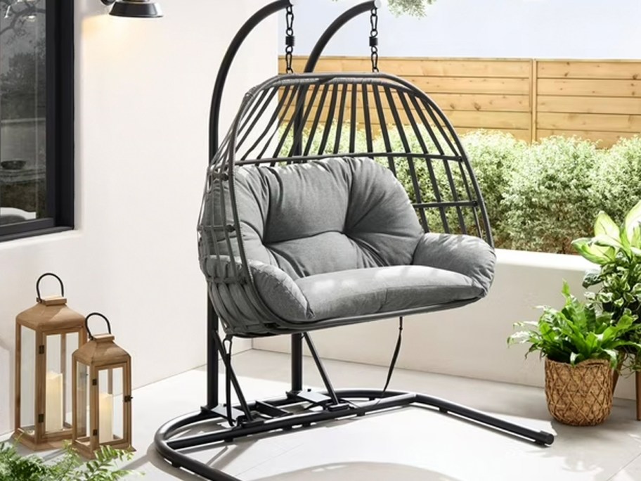 gray double hanging egg chair on patio 