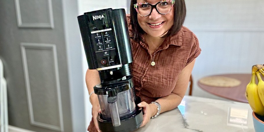 woman holding ninja creami machine