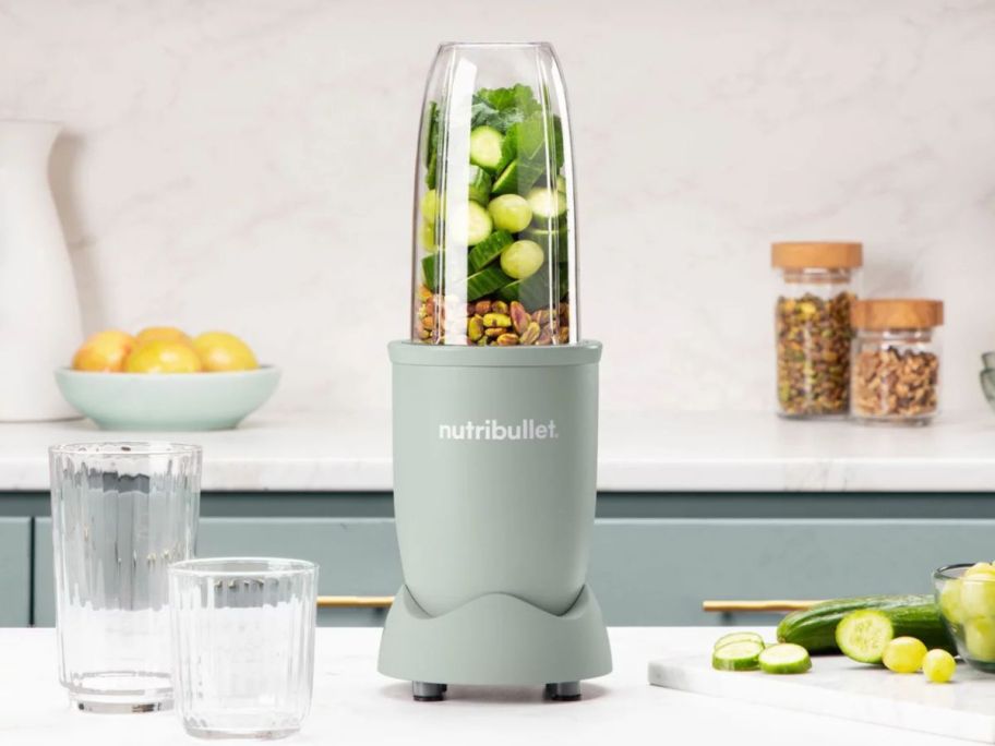 grey NutriBullet Pro 900W Blender with ingredients in it on the counter
