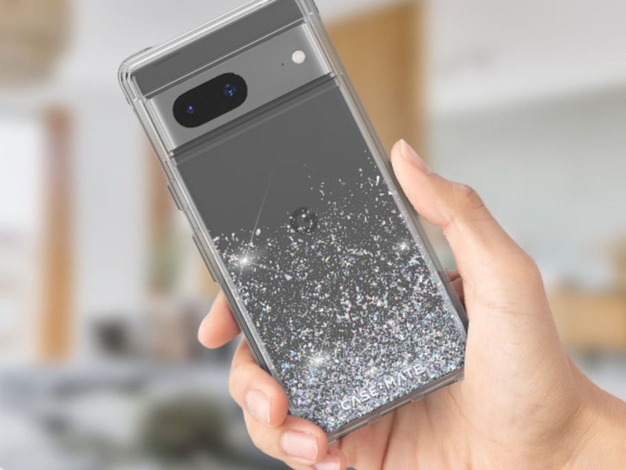 hand holding grey phone case with silver glitter inside it