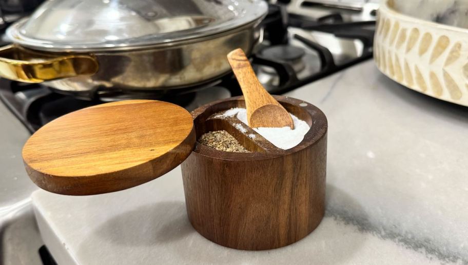 wooden salt and pepper holder on marble kitchen counter