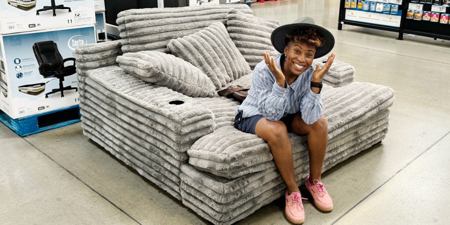 woman sitting on gray oversized lounge chair