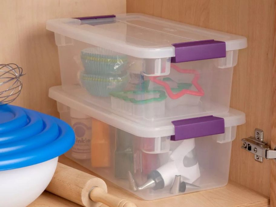 two Sterilite 6-Quart ClearView Storage Bins stacked on top of each other in kitchen cabinet with kitchen tools inside of them