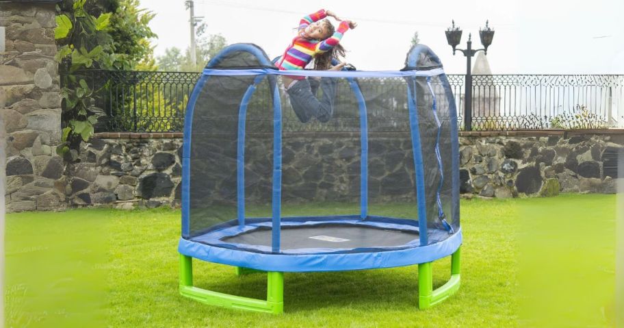 kid jumping in Bounce Pro 7' My First Trampoline Hexagon in yard