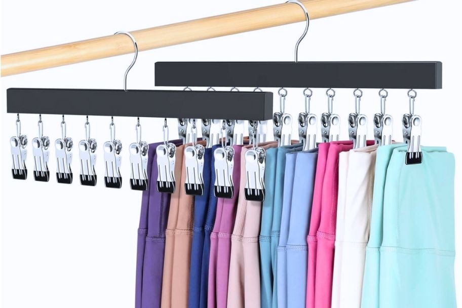 two hanging organizers. one empty and one with leggings, with 10 clips each