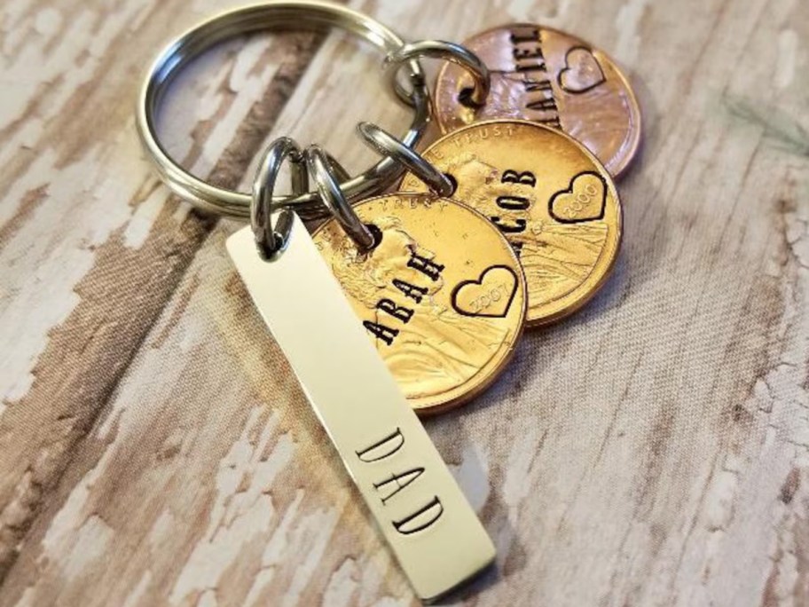 a keychain with hammered pennies with engraved names