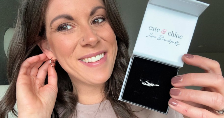 woman showing off Cate & Chloe Hoop Earrings