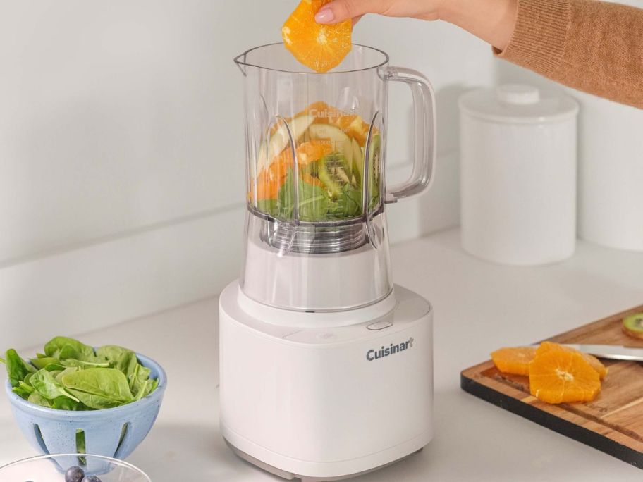 Cuisinart Soho Collection Blender on a counter being filled with fruits