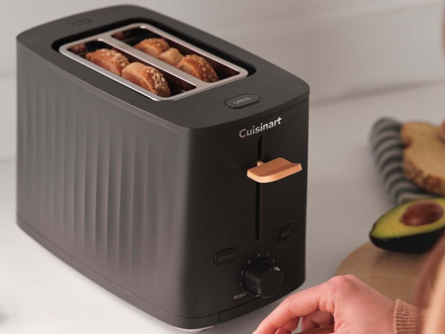 A Black Cuisinart Soho Collection Toaster with bread in it