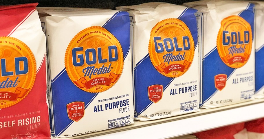 row of bags of Gold Medal Flour on store shelf