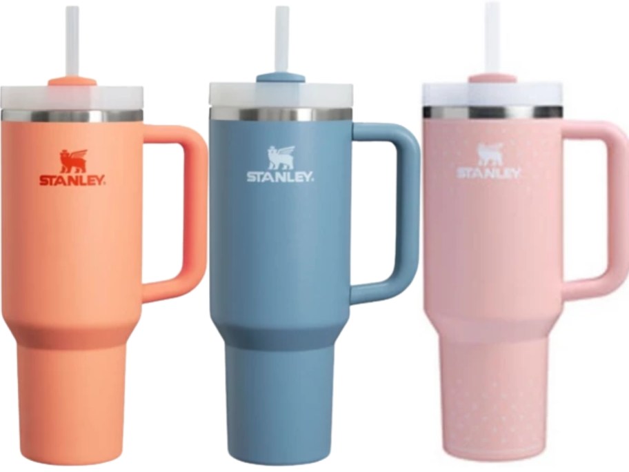 a peach, blue, and pink Stanley Tumbler
