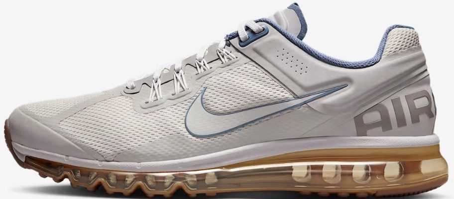 A white, gold and blue mens Nike running shoe