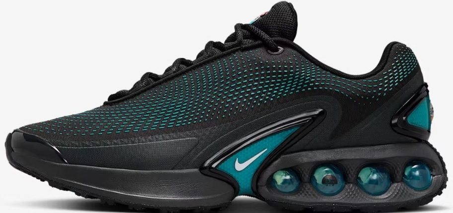 A black, and teal green mens Nike running shoe