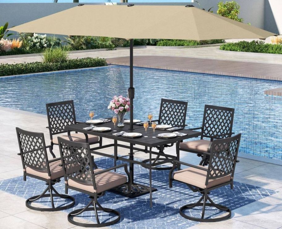 an 8 piece dining set next to a pool