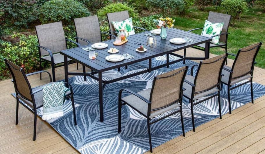 a black 9 piece outdoor dining set