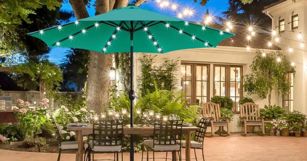 Turquoise solar powered tilt umbrella outside with patio table