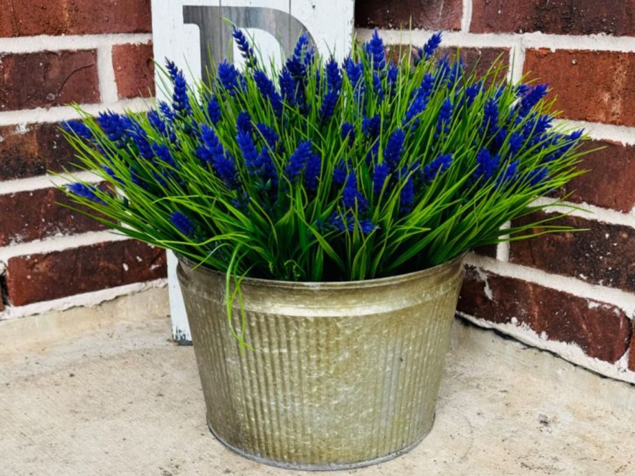 A galvanized bucket filled with Trytuny faux lavender flowers