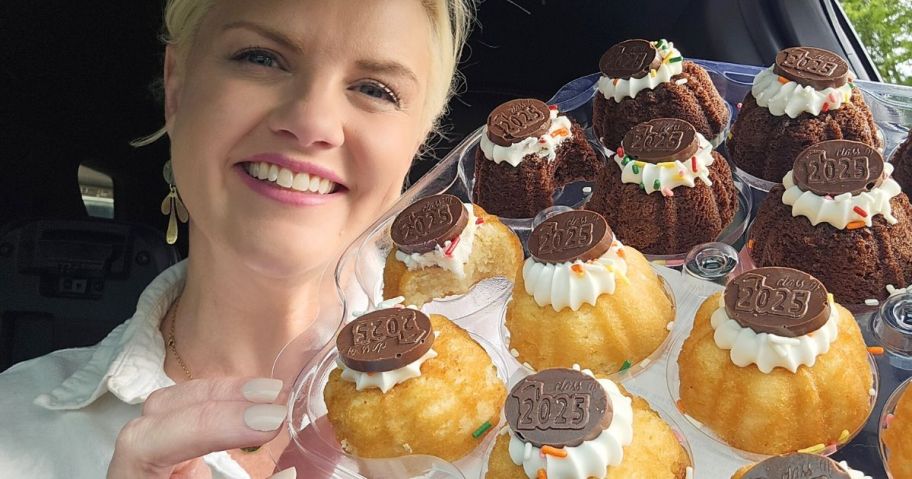 Woman holding up a pack of vanilla and chocolate mini bundt cakes