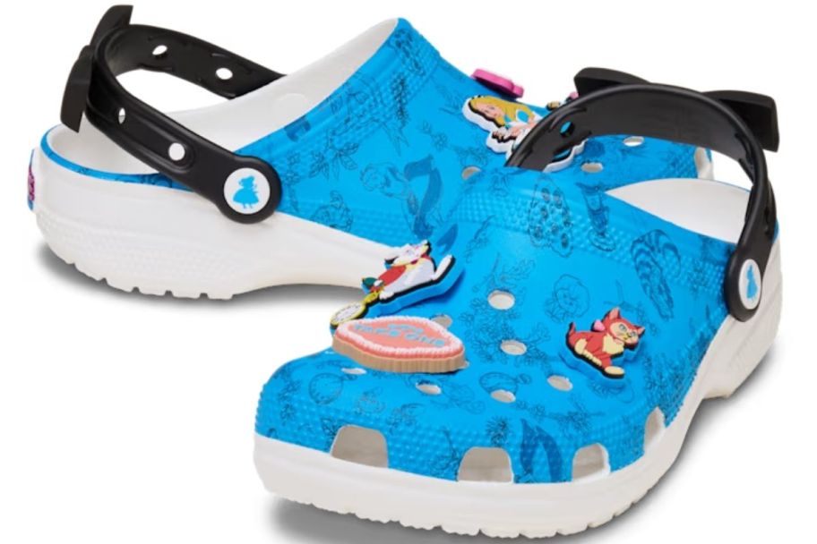 a pair of alice in wonderland themed crocs with jibits