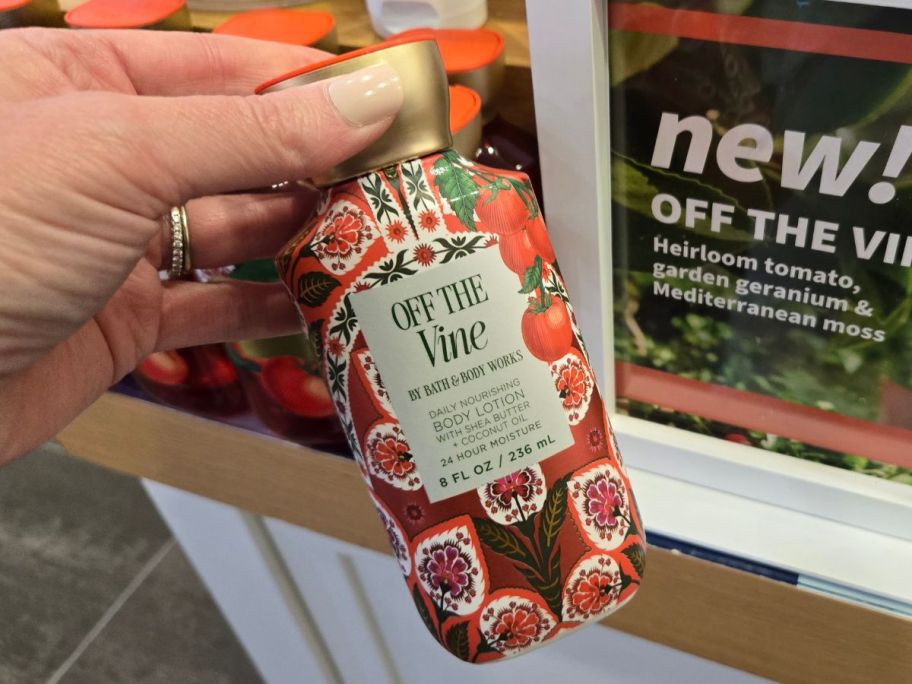 Bath & Body Works Off The Vine Body Lotion in hand in store