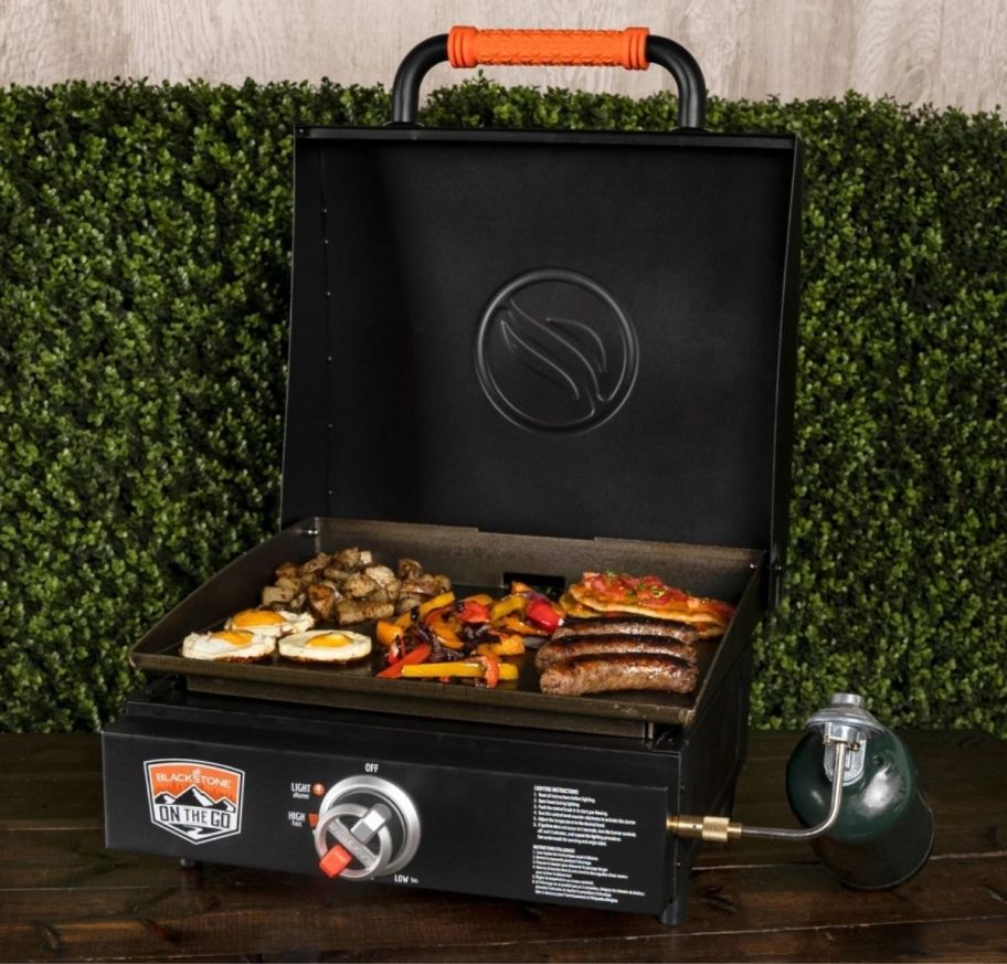a portable tabletop griddle shown with food cooking on it