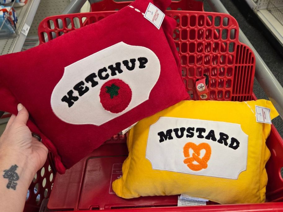 a ketchup and a mustard pillow in cart in store