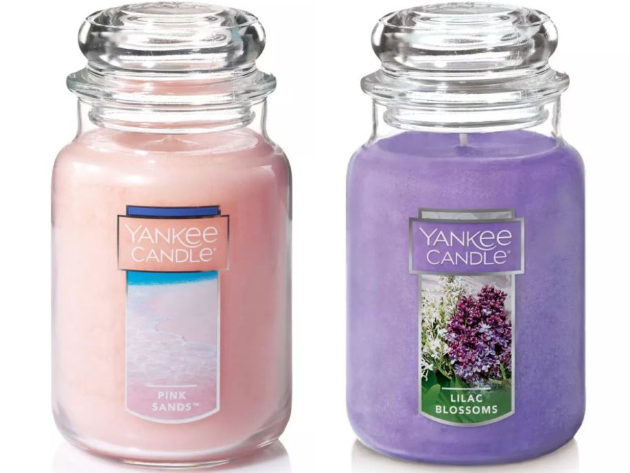 a pink sands and a lilca blossoms large yankee candle stock images