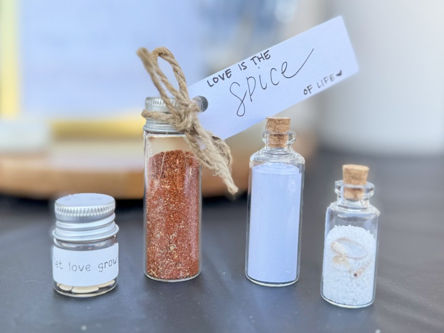 mini glass bottles with spices, sand, and seeds