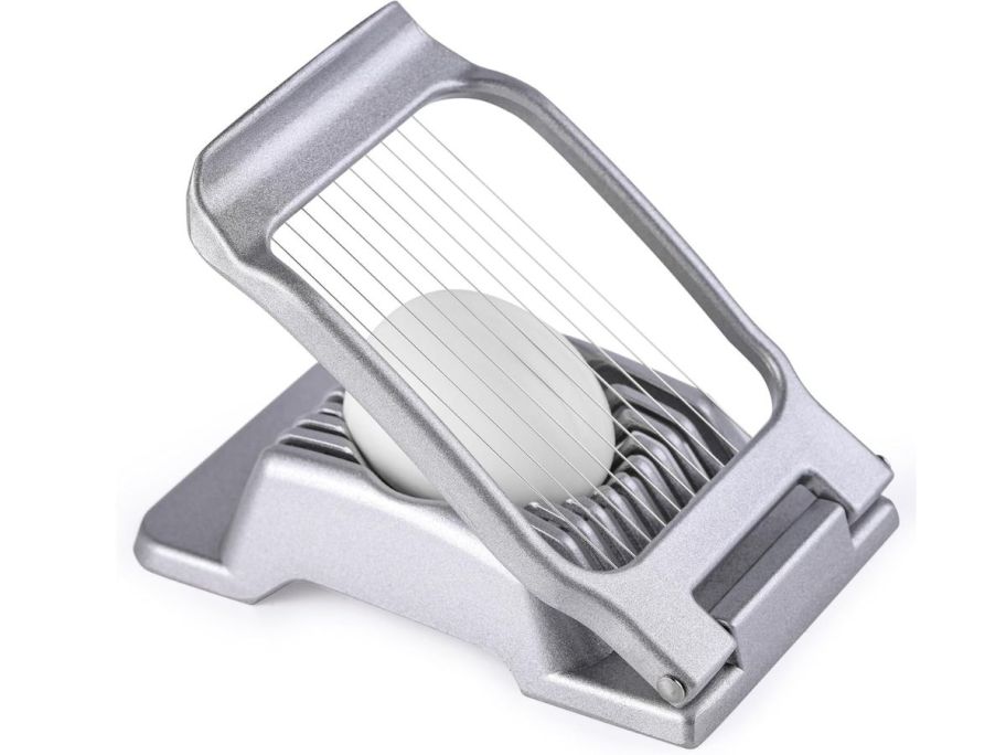 a stock image of an egg slicer with an egg in it