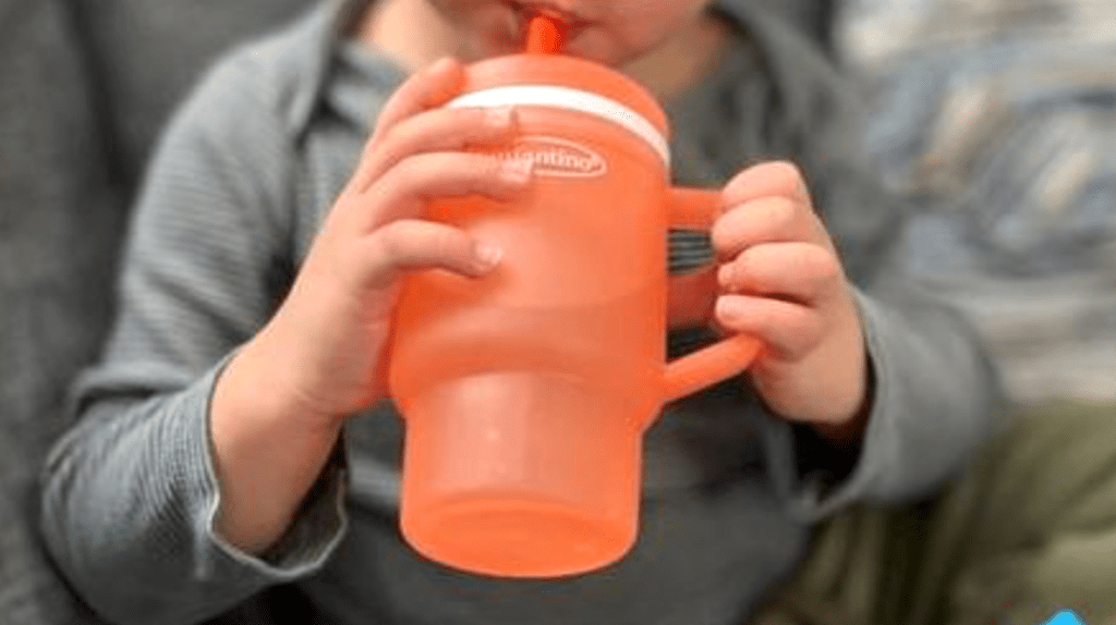 holding Infantino bottle 