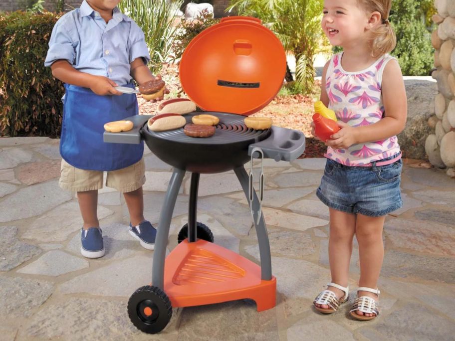 two kids playing with Little Tikes Sizzle & Serve Toy Grill